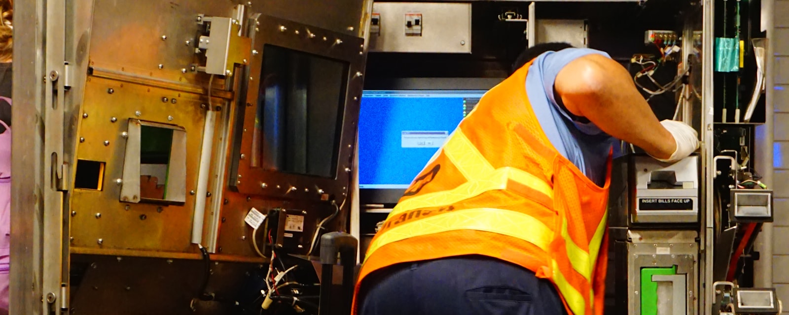 An HVAC technician working on an air conditioning unit